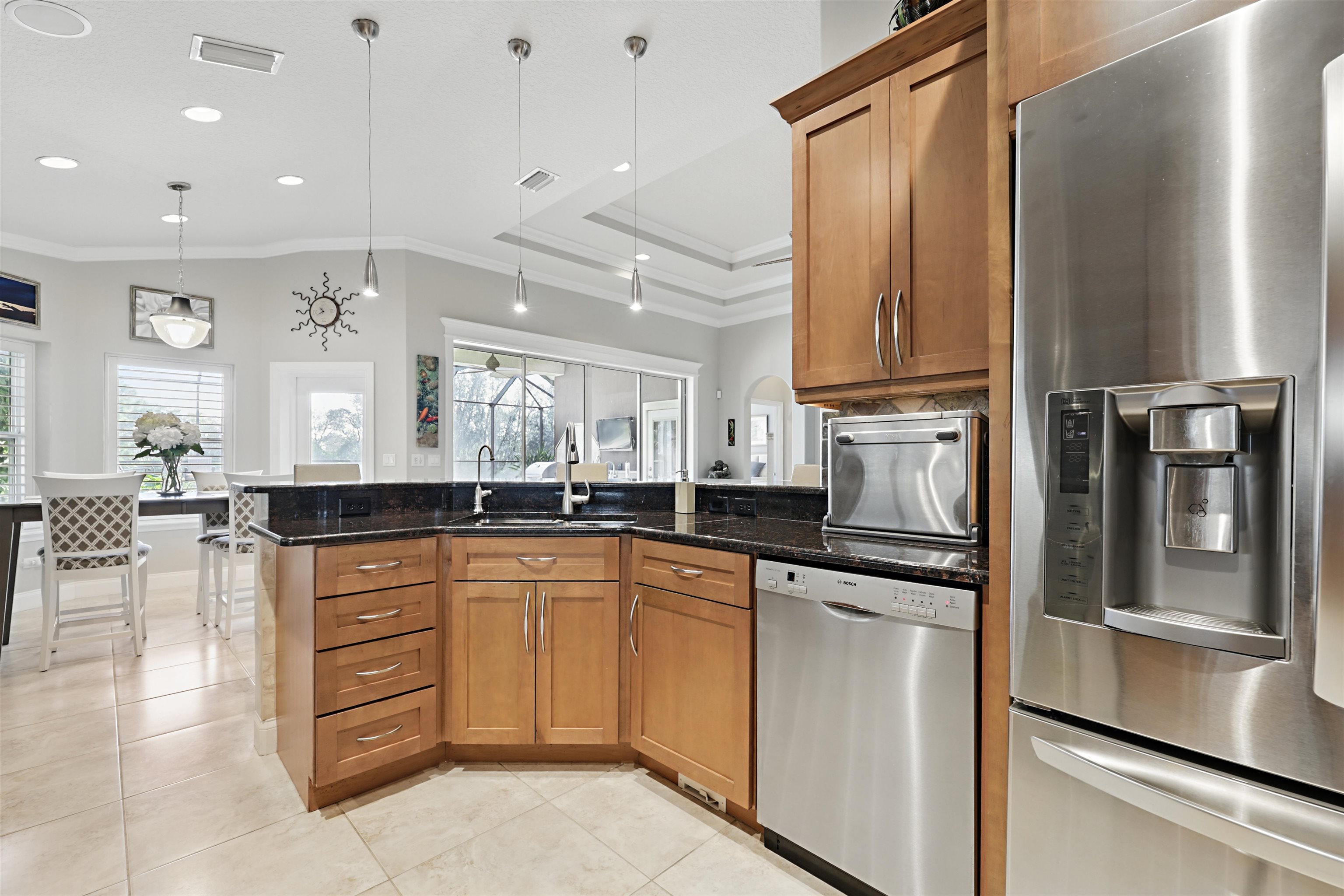 322 Fiddlers Point Drive St. Augustine, FL 32080 - Photo 17 of 58 a kitchen with stainless steel appliances granite countertop a refrigerator and a stove top oven