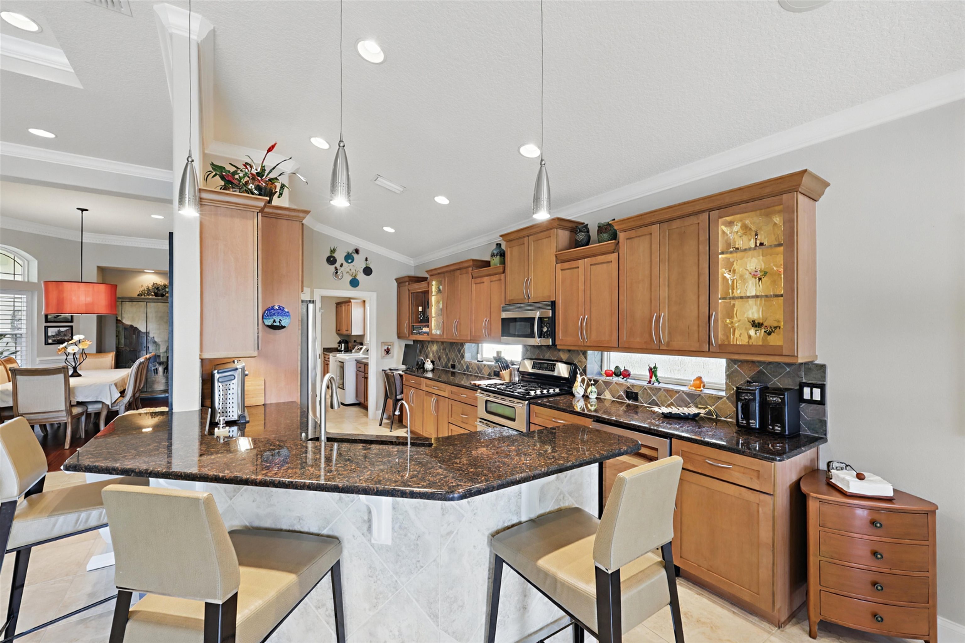 322 Fiddlers Point Drive St. Augustine, FL 32080 - Photo 19 of 58 a kitchen with stainless steel appliances granite countertop counter space a sink and cabinets