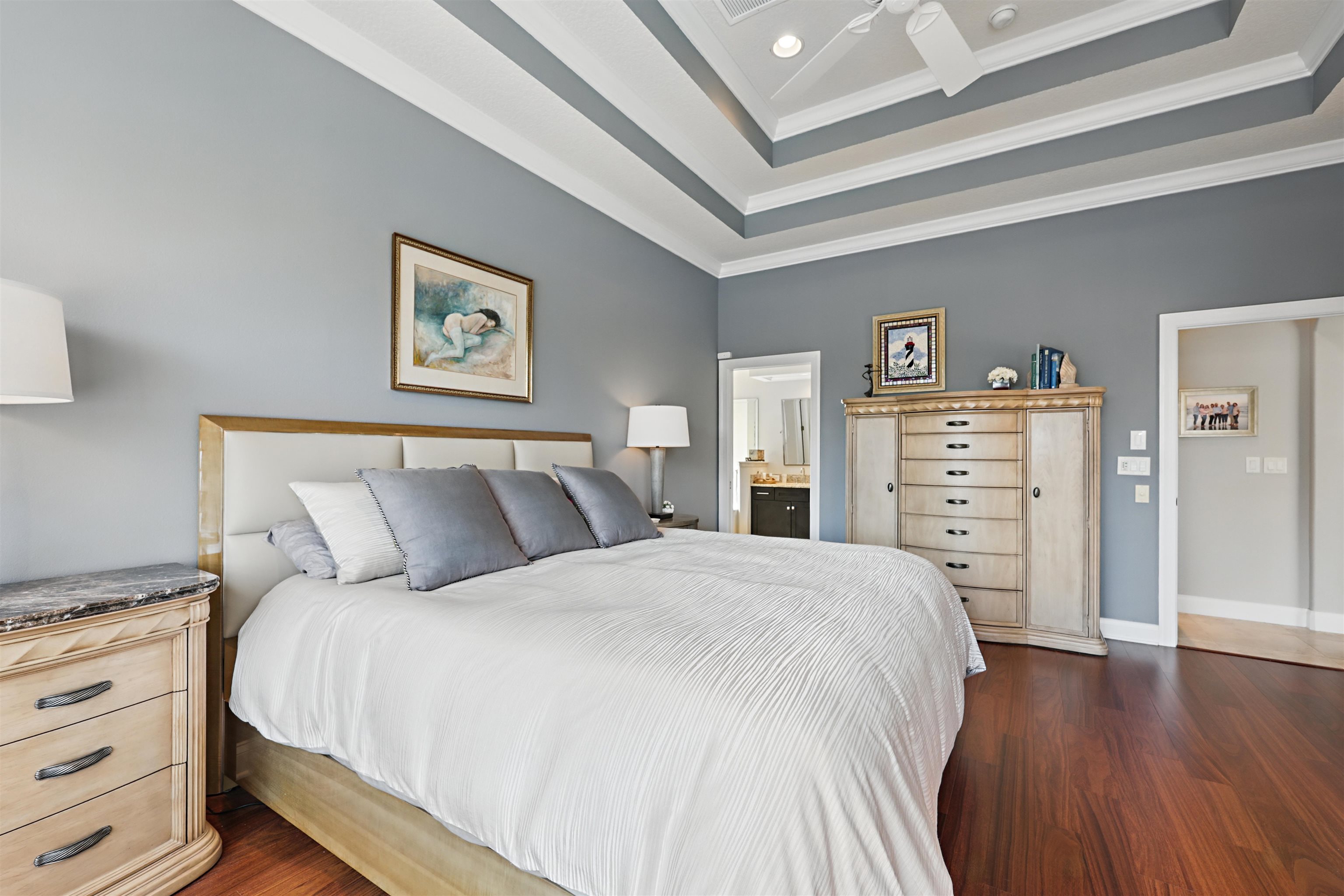 322 Fiddlers Point Drive St. Augustine, FL 32080 - Photo 21 of 58 a bedroom with a bed and wooden floor