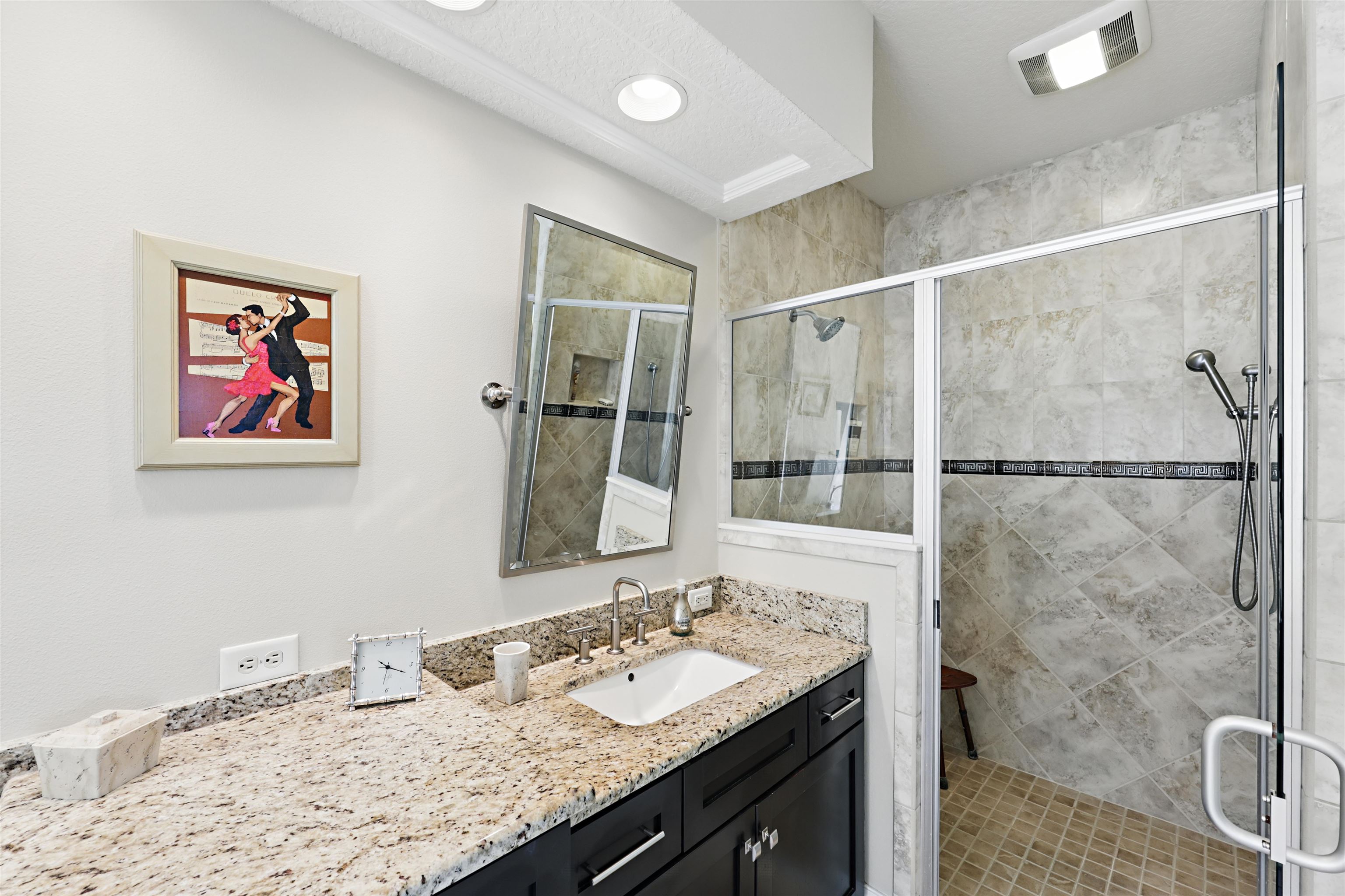 322 Fiddlers Point Drive St. Augustine, FL 32080 - Photo 25 of 58 a bathroom with a granite countertop sink a mirror and a shower