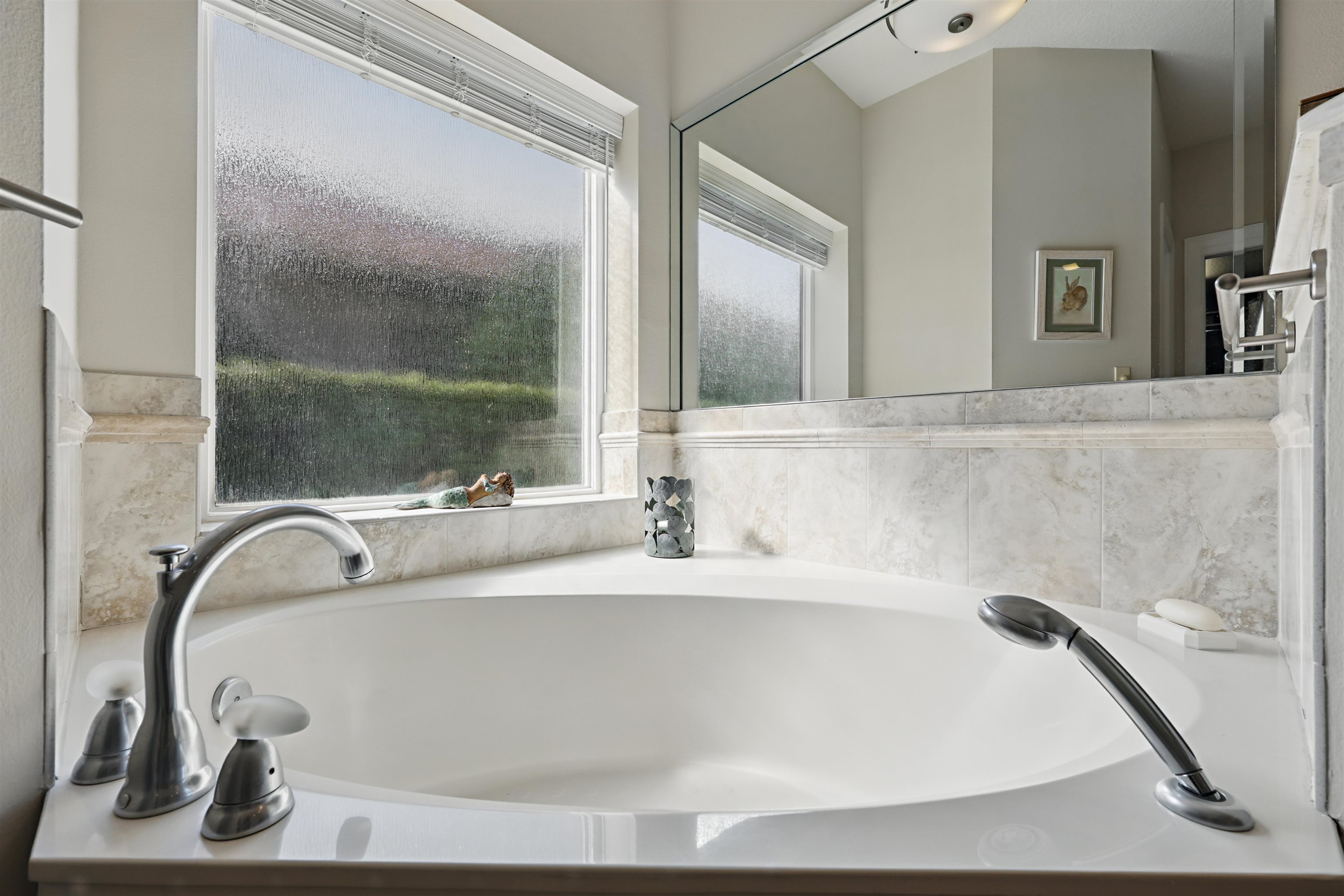 322 Fiddlers Point Drive St. Augustine, FL 32080 - Photo 27 of 58 a bathroom with a bathtub and a sink