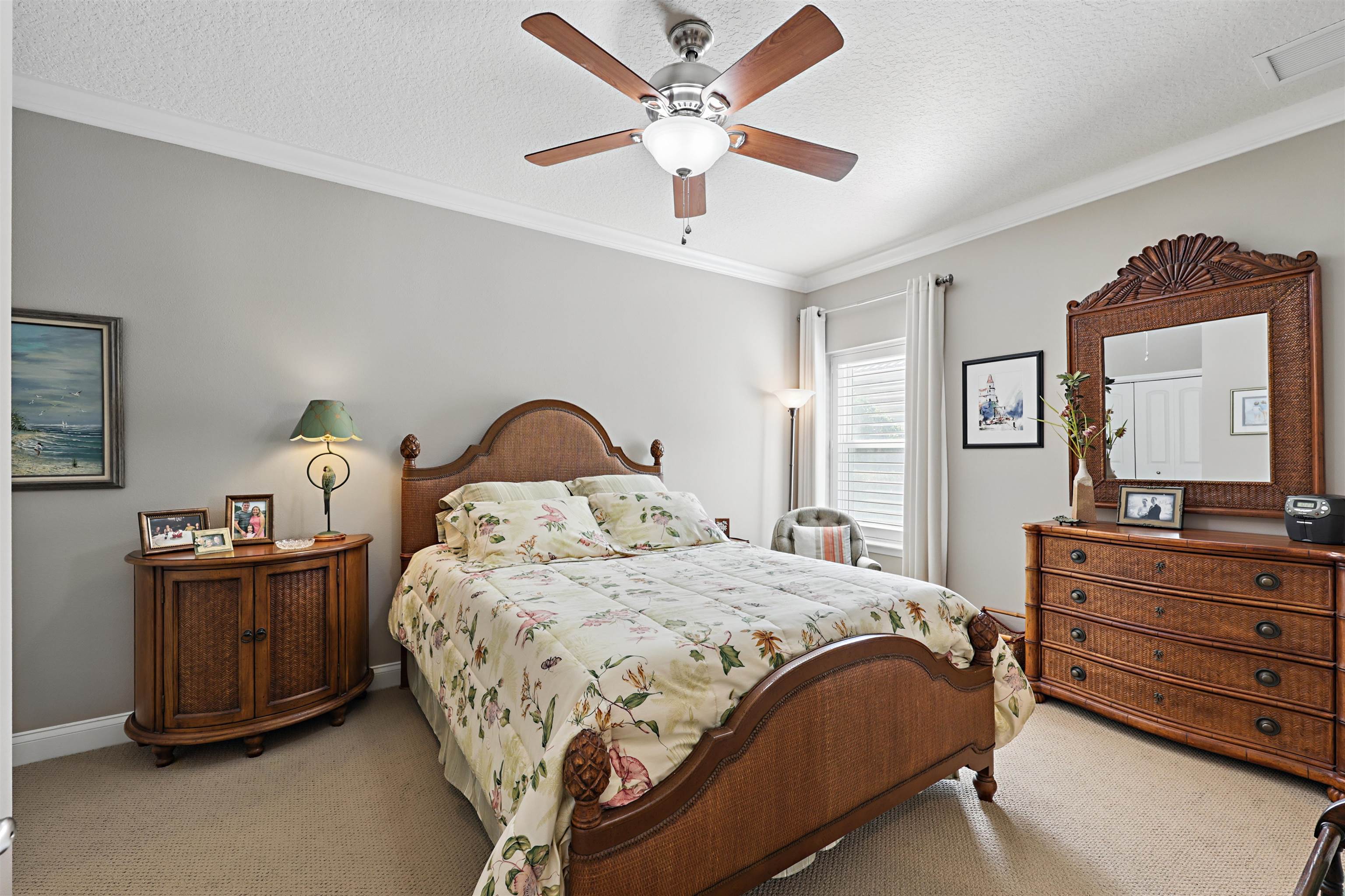 322 Fiddlers Point Drive St. Augustine, FL 32080 - Photo 28 of 58 a bedroom with a bed and a dresser