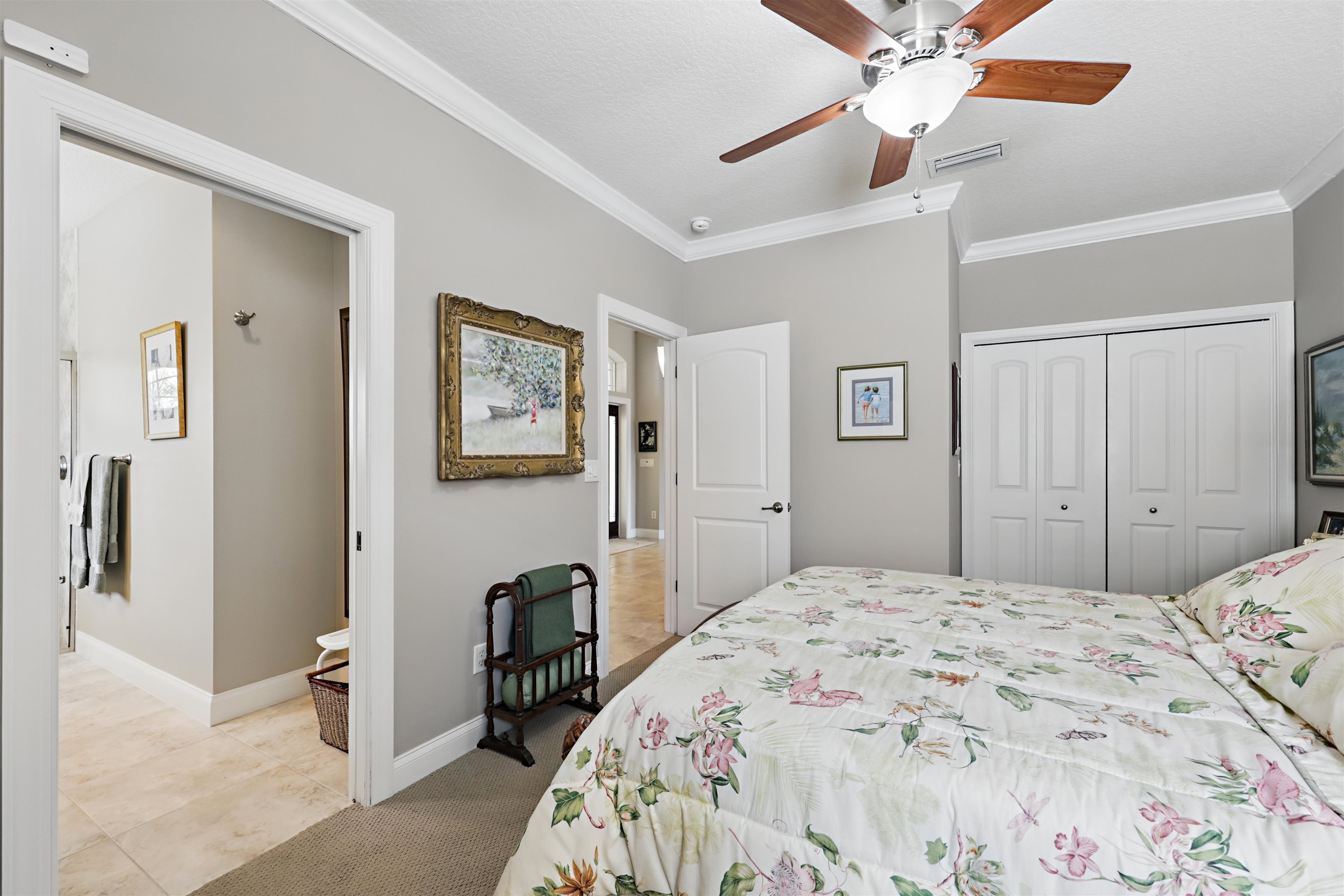 322 Fiddlers Point Drive St. Augustine, FL 32080 - Photo 29 of 58 a bedroom with a bed and wooden floor