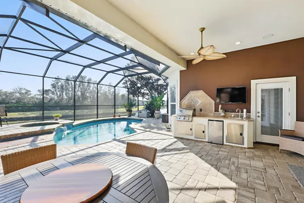 a view of a swimming pool with a patio