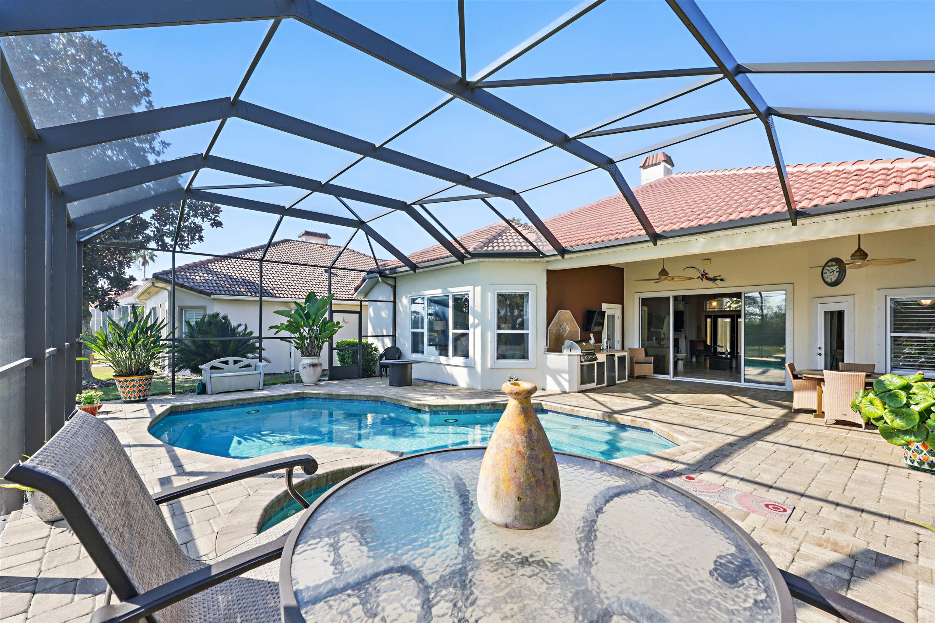 322 Fiddlers Point Drive St. Augustine, FL 32080 - Photo 40 of 58 a view of a swimming pool with a patio