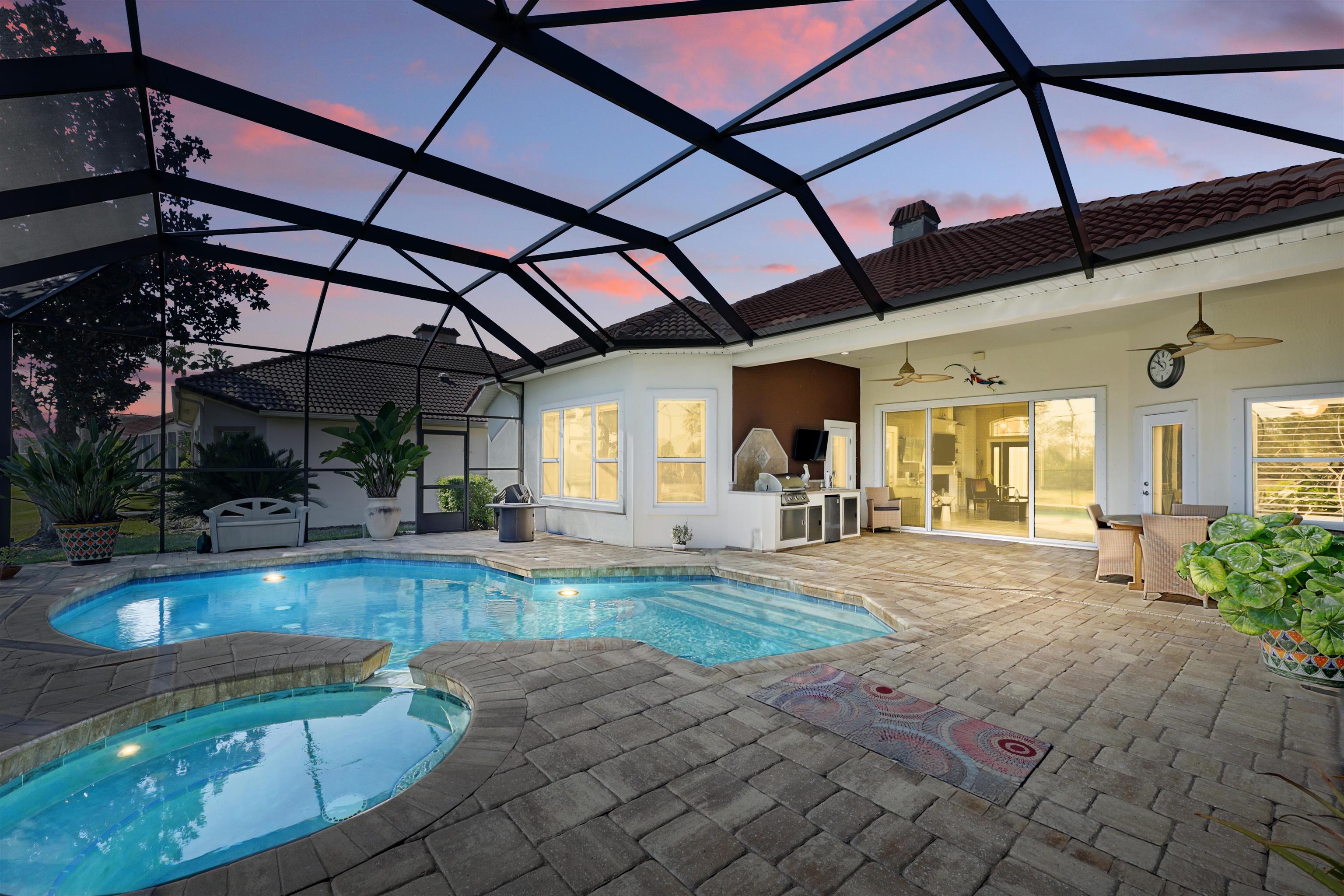 322 Fiddlers Point Drive St. Augustine, FL 32080 - Photo 43 of 58 a view of a swimming pool with a patio