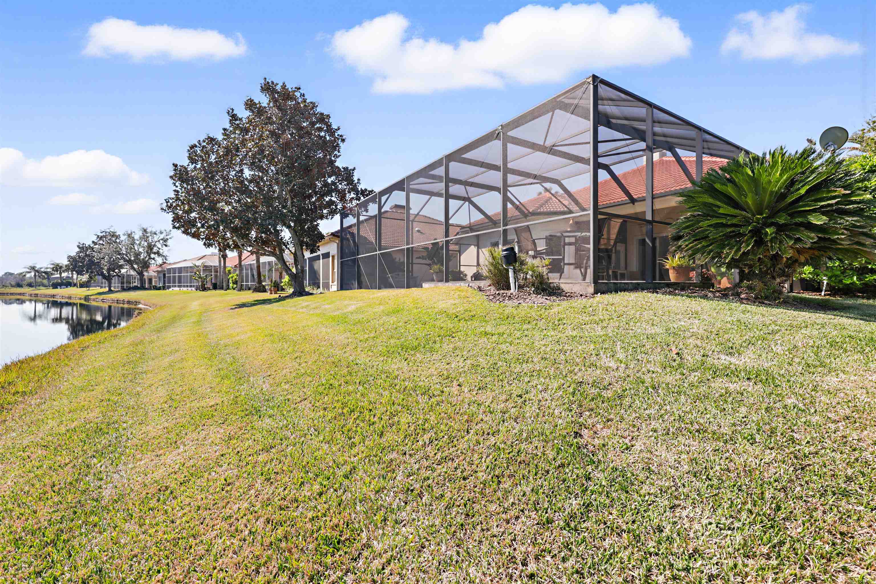 322 Fiddlers Point Drive St. Augustine, FL 32080 - Photo 48 of 58 a view of a house with a yard and sitting area