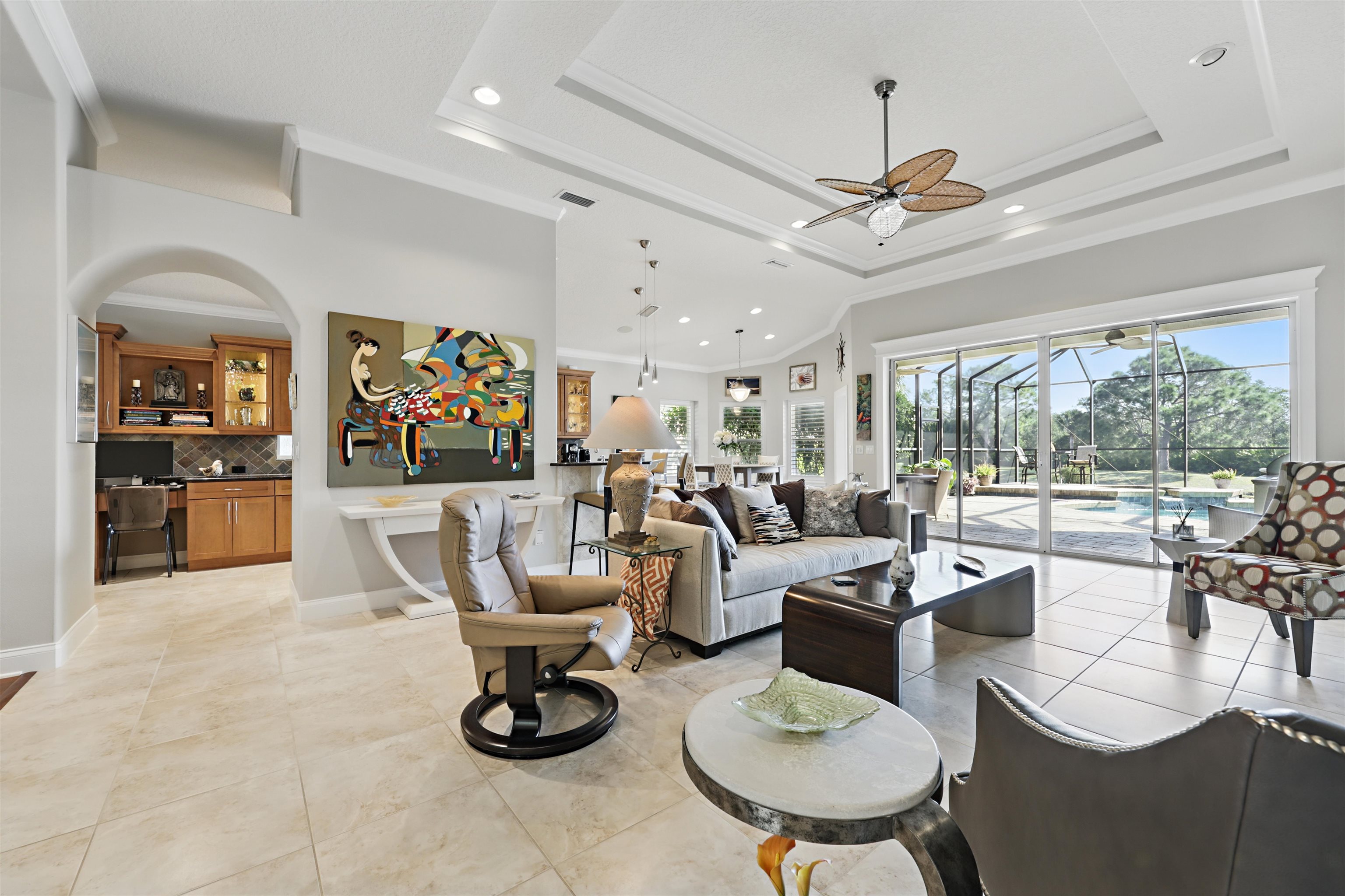 322 Fiddlers Point Drive St. Augustine, FL 32080 - Photo 9 of 58 a living room with lots of white furniture and a large window