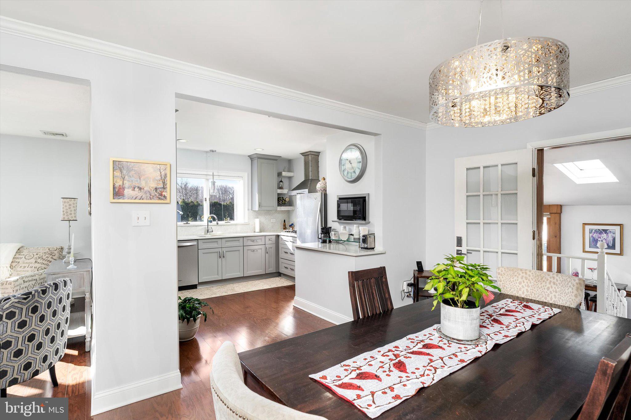 151 Walnford Road Allentown, NJ 08501 - Photo 10 of 48 a living room with furniture and a chandelier