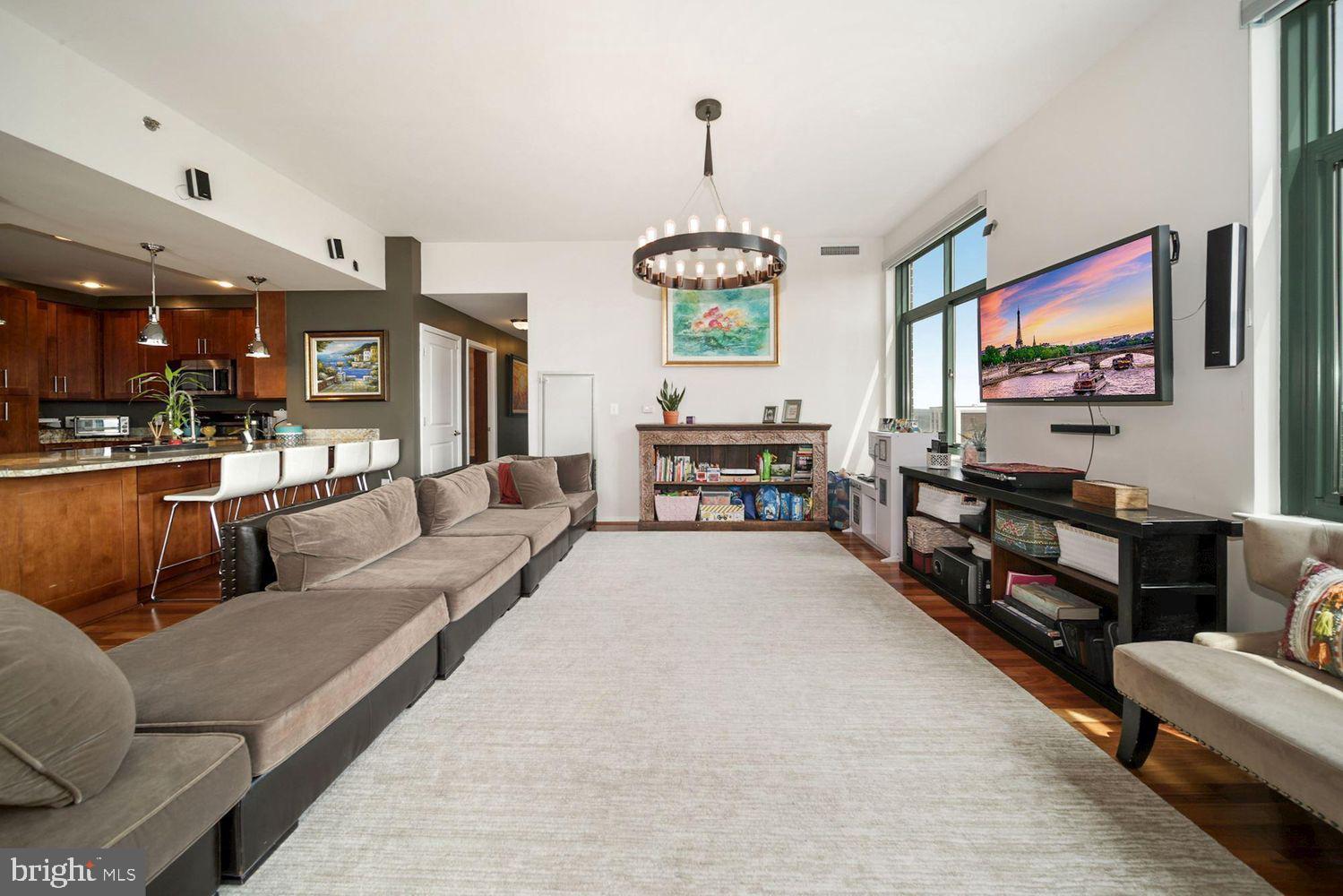 11700 Old Georgetown Road, Unit 1405 North Bethesda, MD 20852 - Photo 9 of 17 a living room with furniture and a flat screen tv