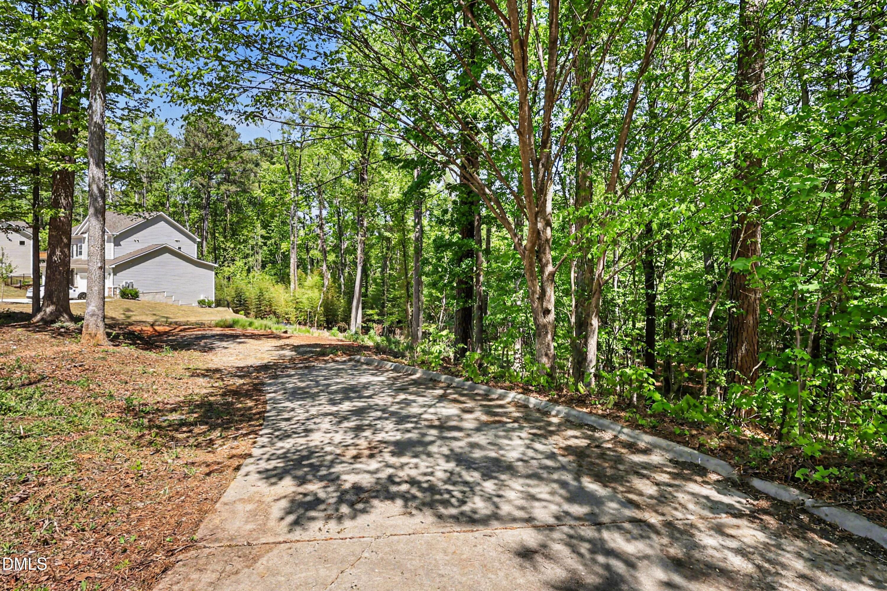 810 Southwest Maynard Road Cary, NC 27511 - Photo 5 of 14 a view of house with backyard and trees