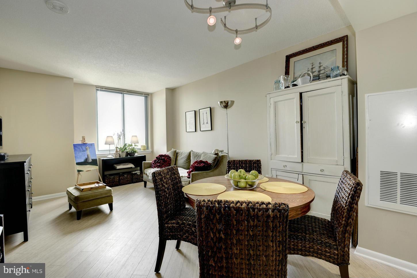851 North Glebe Road, Unit 1316 Arlington, VA 22203 - Photo 6 of 22 a view of a dining room with furniture and wooden floor
