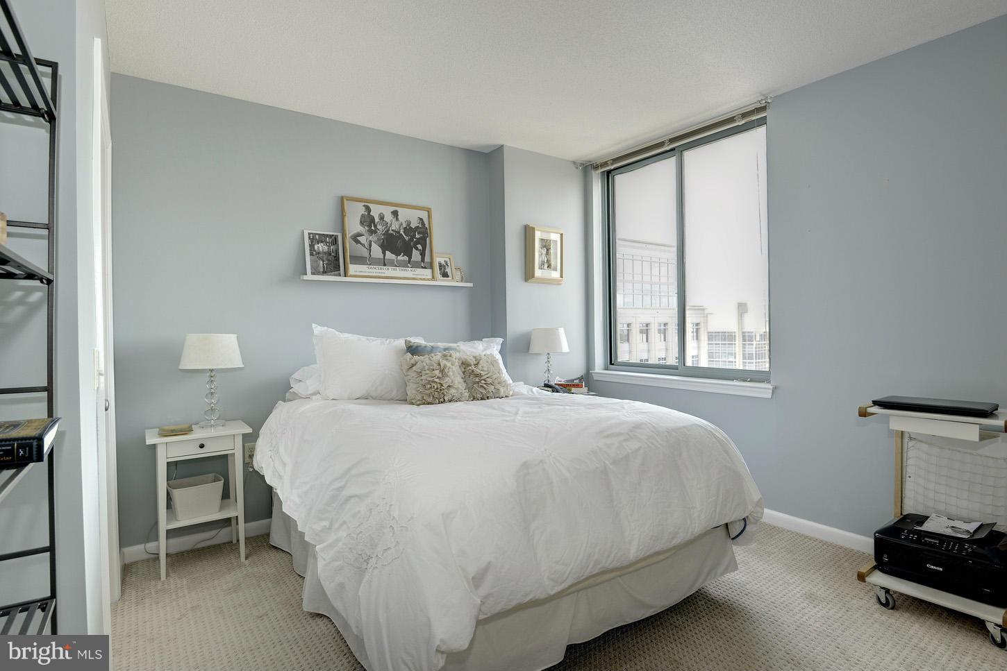 851 North Glebe Road, Unit 1316 Arlington, VA 22203 - Photo 10 of 22 a bedroom with a bed and a window