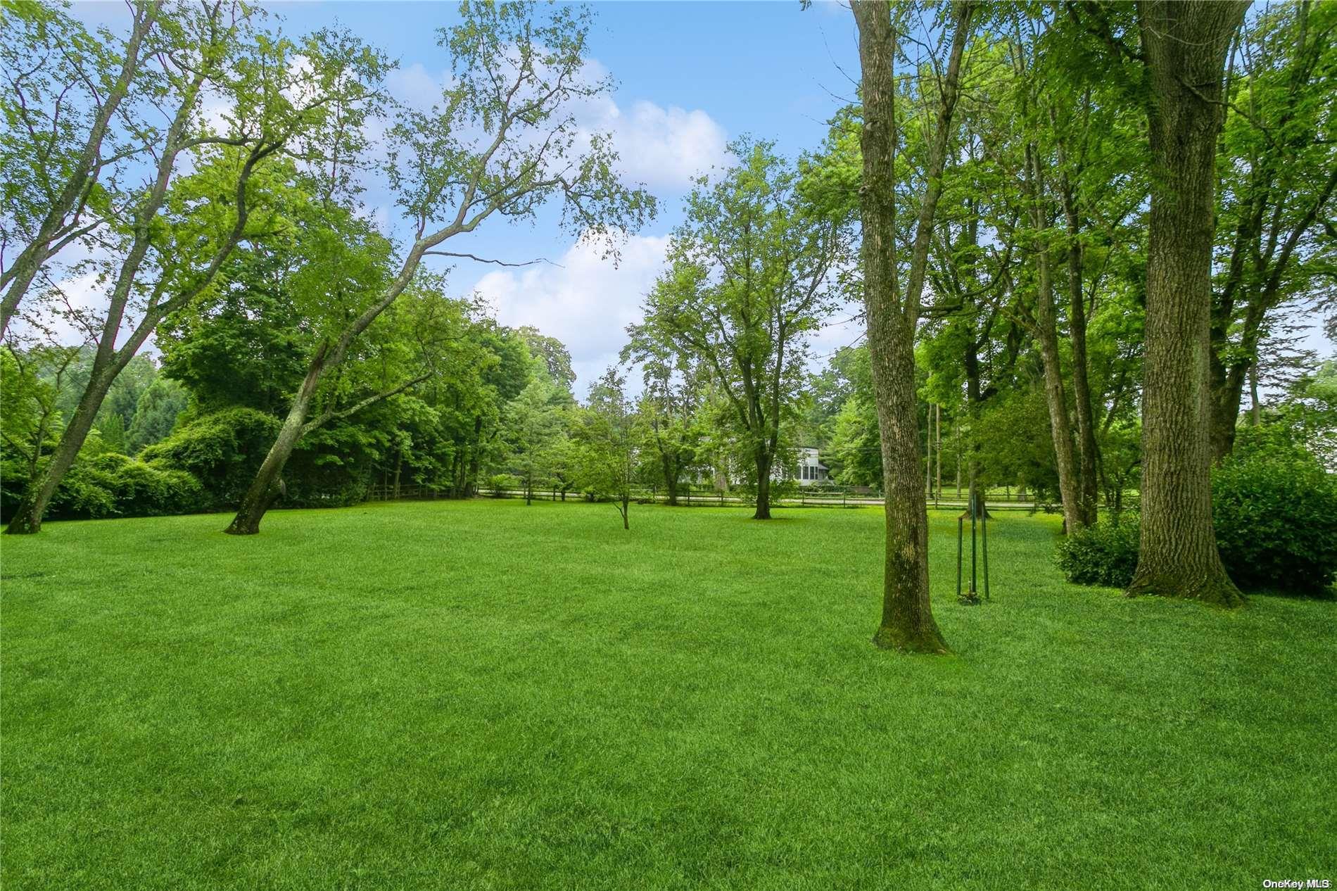 198 D Kings Point Road Great Neck, NY 11024 - Photo 1 of 1 a green field with lots of trees in it