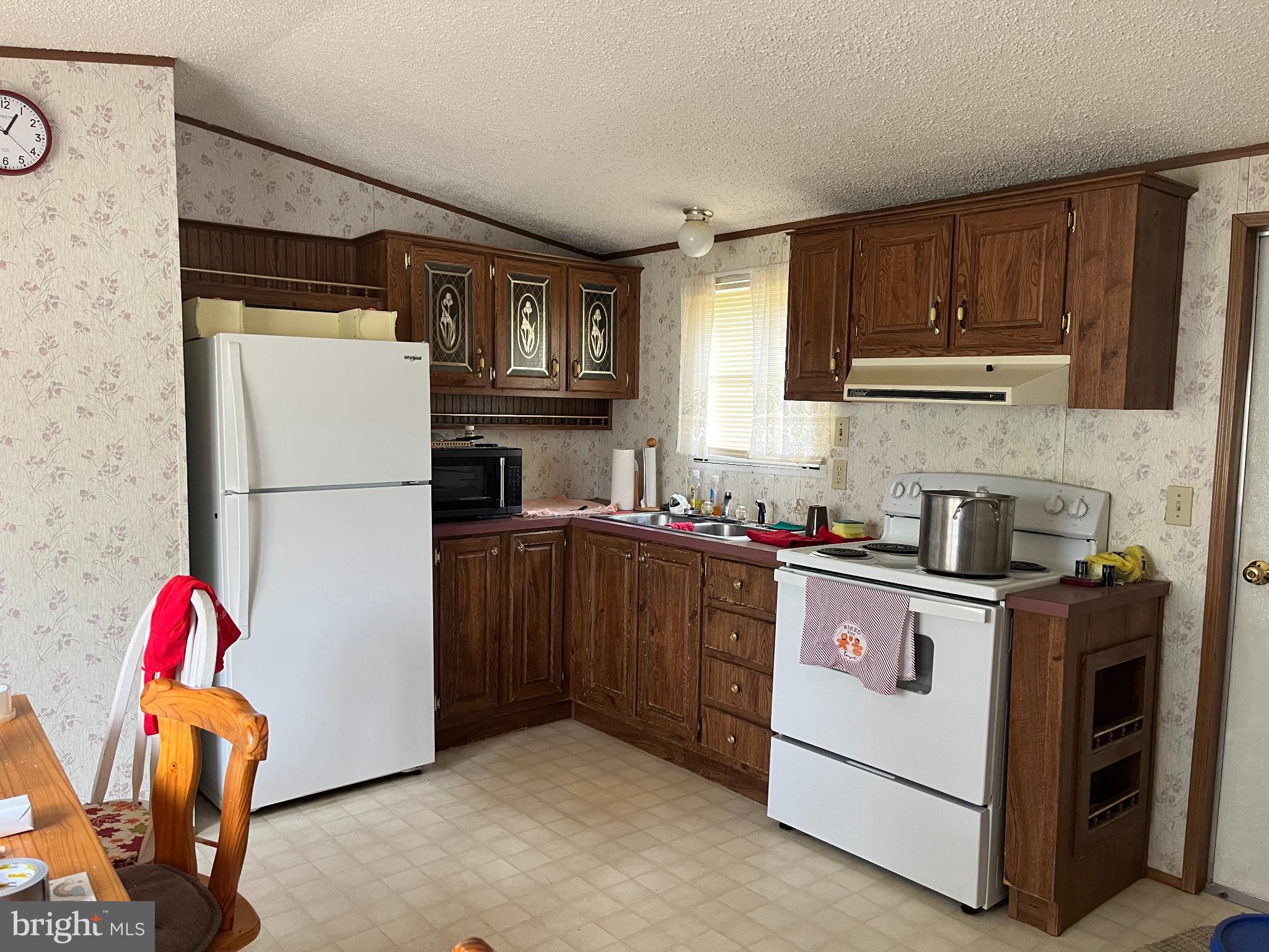291 Dean Road Toms Brook, VA 22660 - Photo 5 of 21 Cozy kitchen with classic wooden cabinetry.