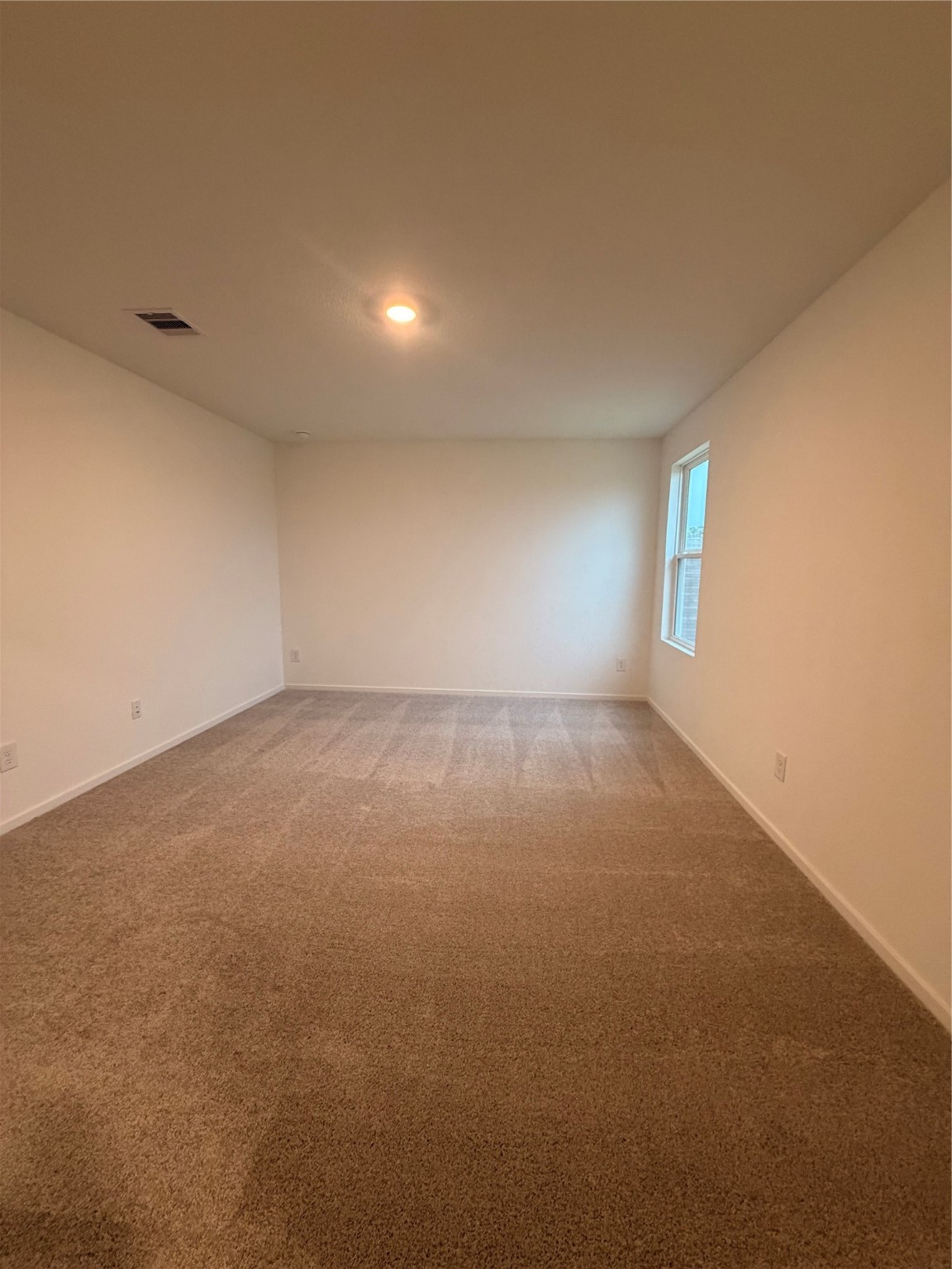 1719 West Stroker Road Crosby, TX 77532 - Photo 22 of 29 an empty room with windows and entrance