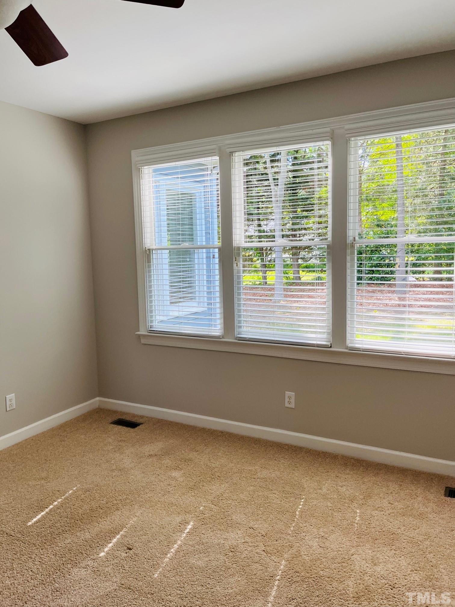 6317 Belle Crest Drive Raleigh, NC 27612 - Photo 13 of 29 a view of an empty room with a window