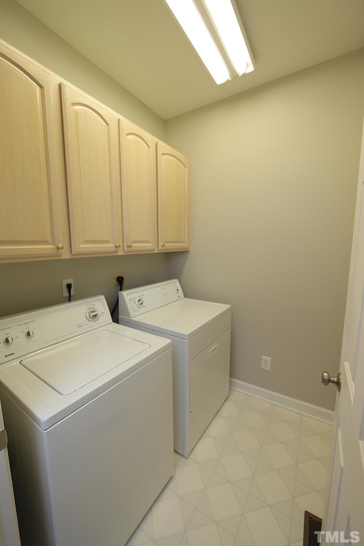 6317 Belle Crest Drive Raleigh, NC 27612 - Photo 16 of 29 a utility room with dryer and washer