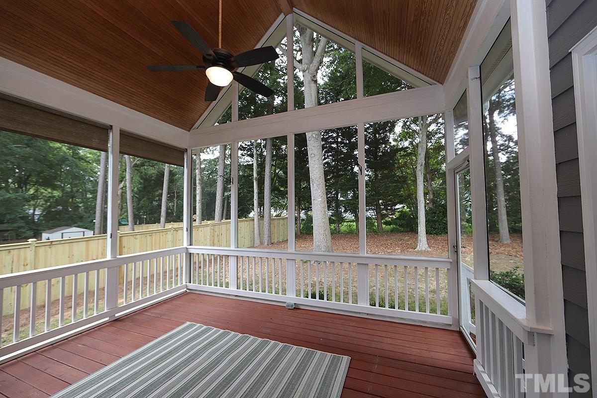 6317 Belle Crest Drive Raleigh, NC 27612 - Photo 22 of 29 a view of a porch with wooden floor and outdoor space
