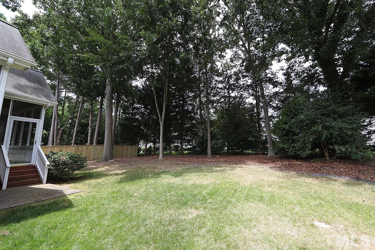 6317 Belle Crest Drive Raleigh, NC 27612 - Photo 25 of 29 a view of a backyard with a trees