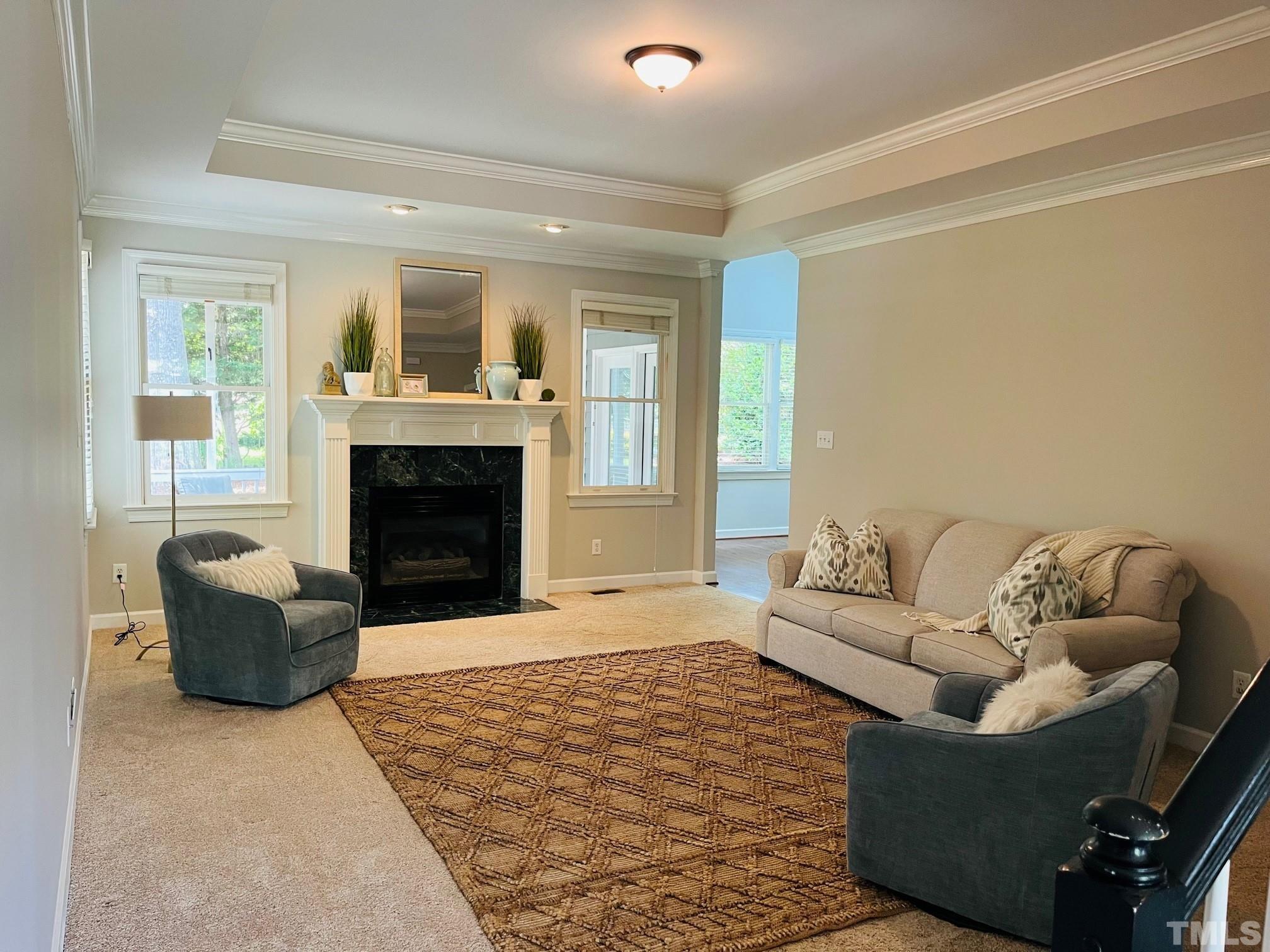 6317 Belle Crest Drive Raleigh, NC 27612 - Photo 5 of 29 a living room with furniture and a fireplace