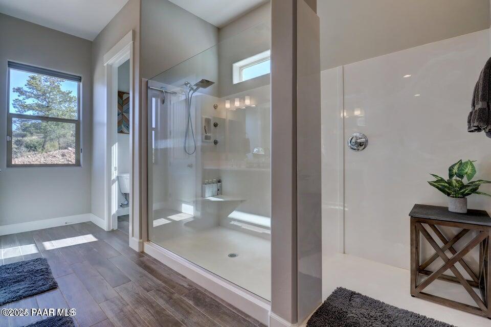 5505 Corliss Circle Prescott, AZ 86305 - Photo 8 of 12 a bathroom with a glass shower door and a toilet