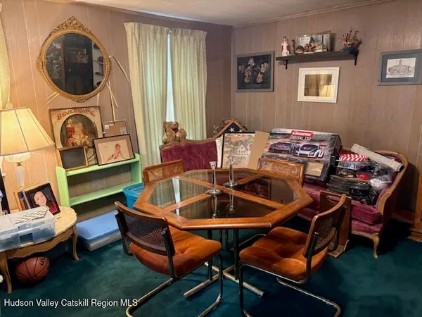 a room with furniture and a wooden floor