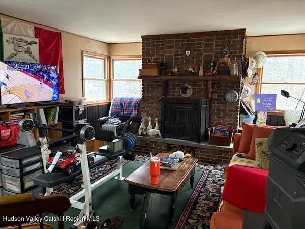 a living room with lots of furniture and appliances