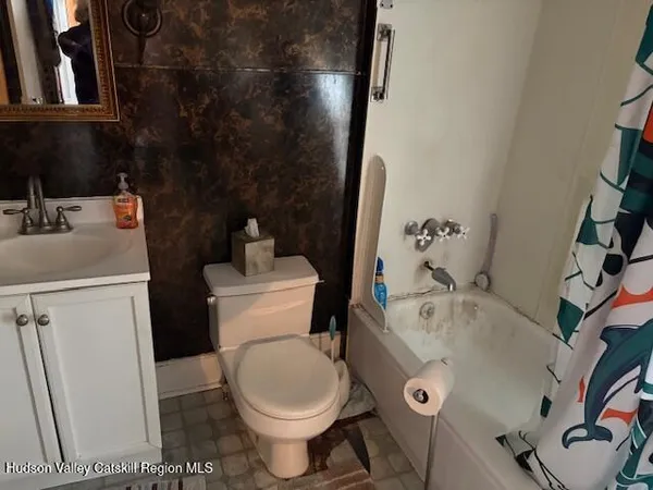 a bathroom with a sink and toilet