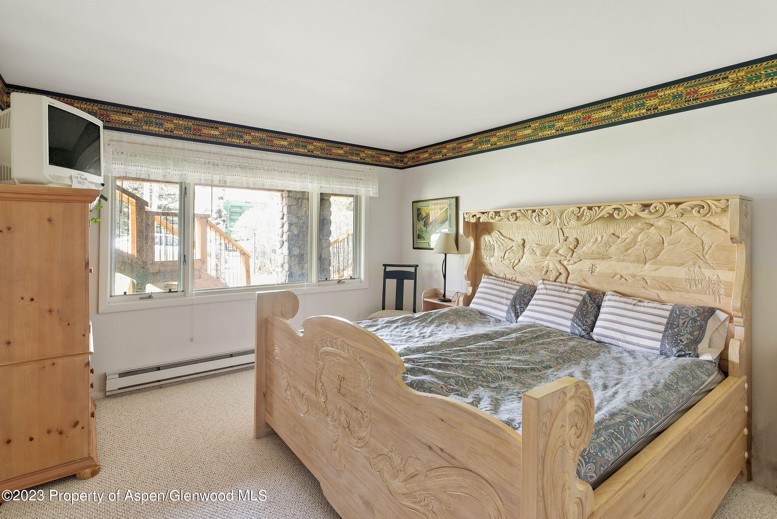 800 Bonita Drive, Unit 1 Aspen, CO 81611 - Photo 16 of 18 a bed sitting in a bedroom next to a window
