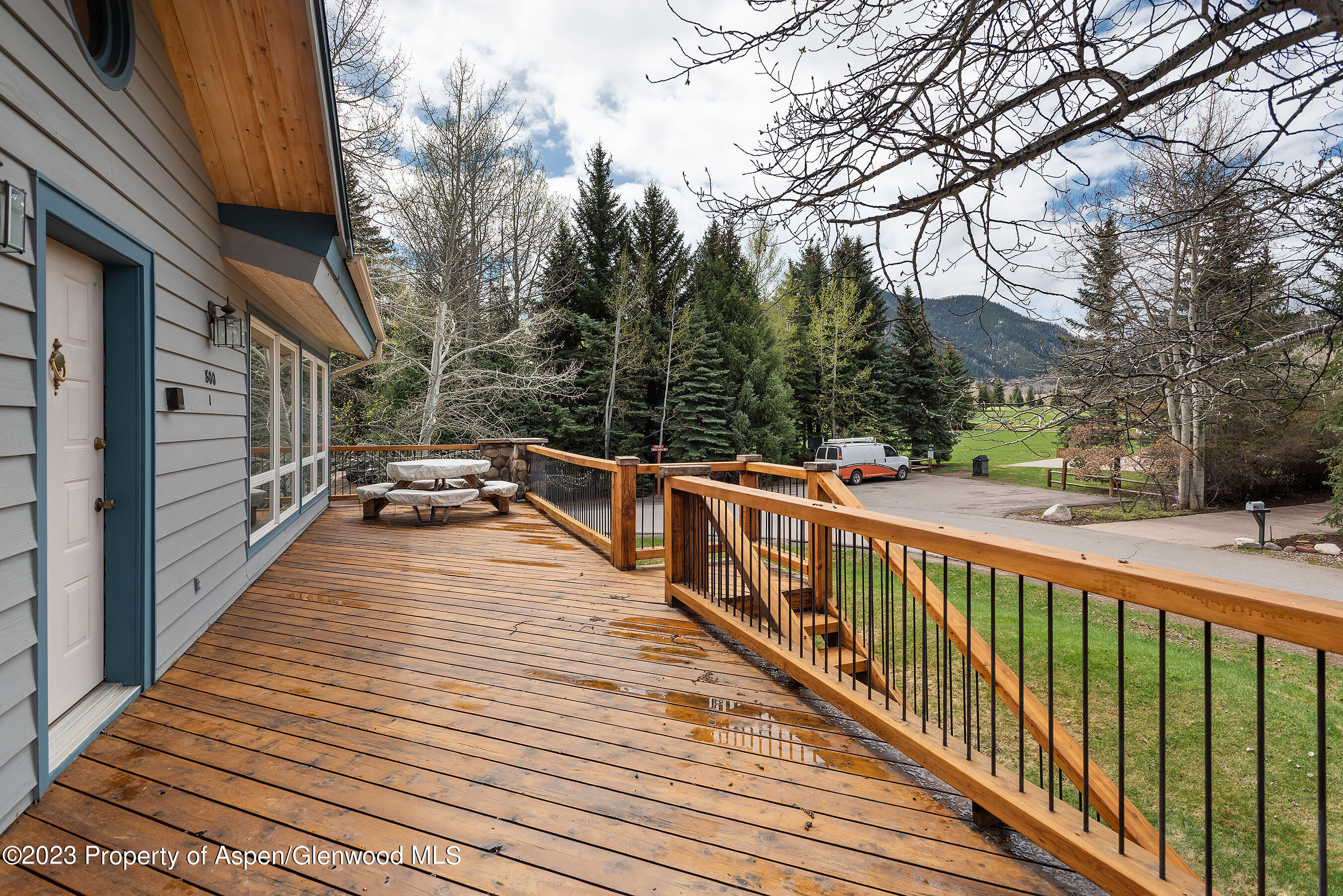 800 Bonita Drive, Unit 1 Aspen, CO 81611 - Photo 3 of 18 a view of balcony with wooden floor and fence