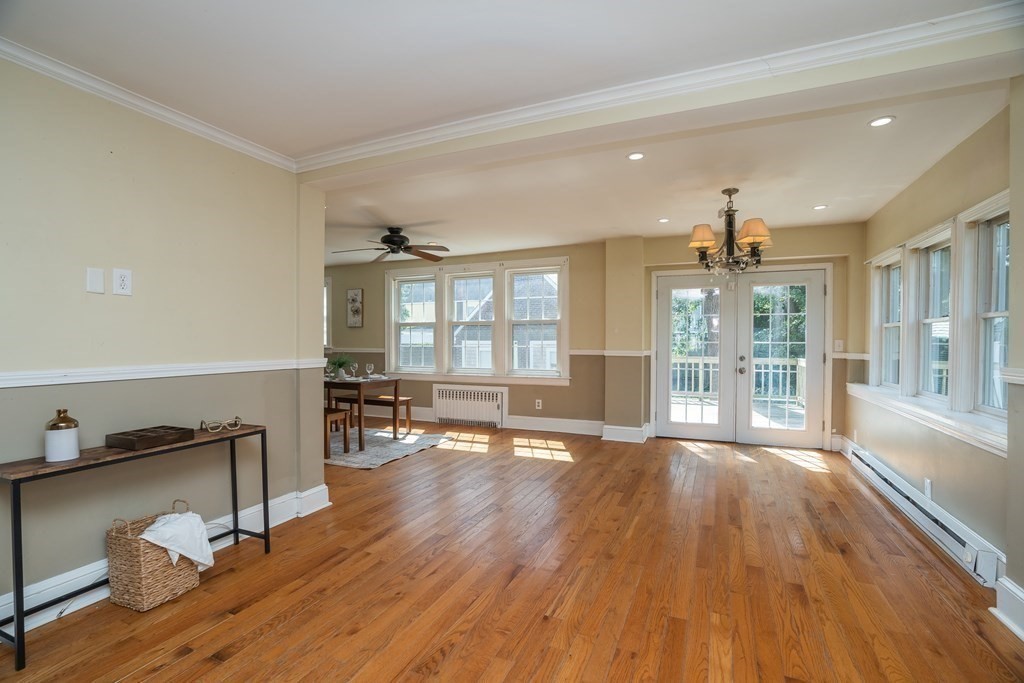 35 Bronson Terrace Springfield, MA 01108 - Photo 15 of 39 a view of an empty room with wooden floor and a window