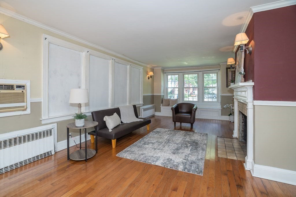 35 Bronson Terrace Springfield, MA 01108 - Photo 19 of 39 a living room with furniture and a fireplace