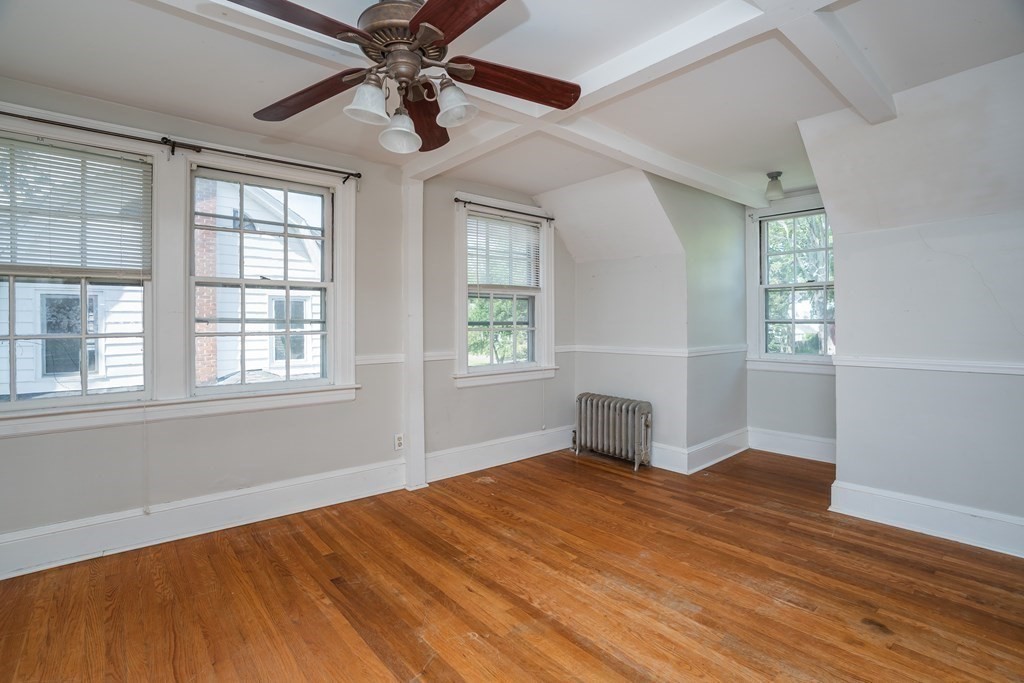 35 Bronson Terrace Springfield, MA 01108 - Photo 31 of 39 a view of empty room with wooden floor and fan