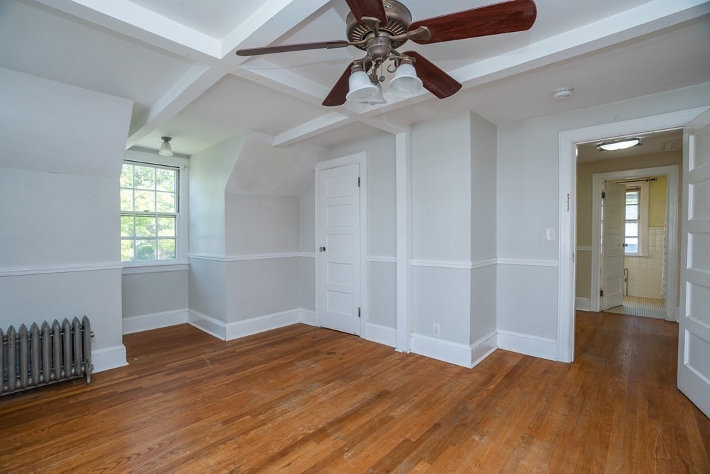 35 Bronson Terrace Springfield, MA 01108 - Photo 32 of 39 wooden floor in an empty room with a window