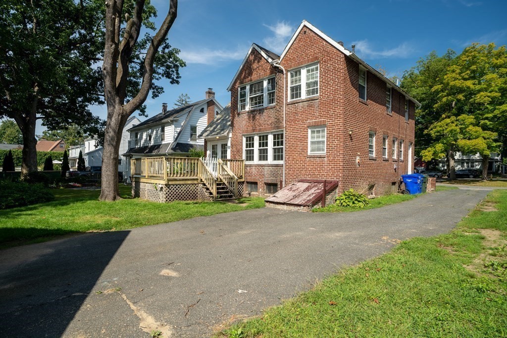35 Bronson Terrace Springfield, MA 01108 - Photo 37 of 39 a front view of a house with a garden and trees