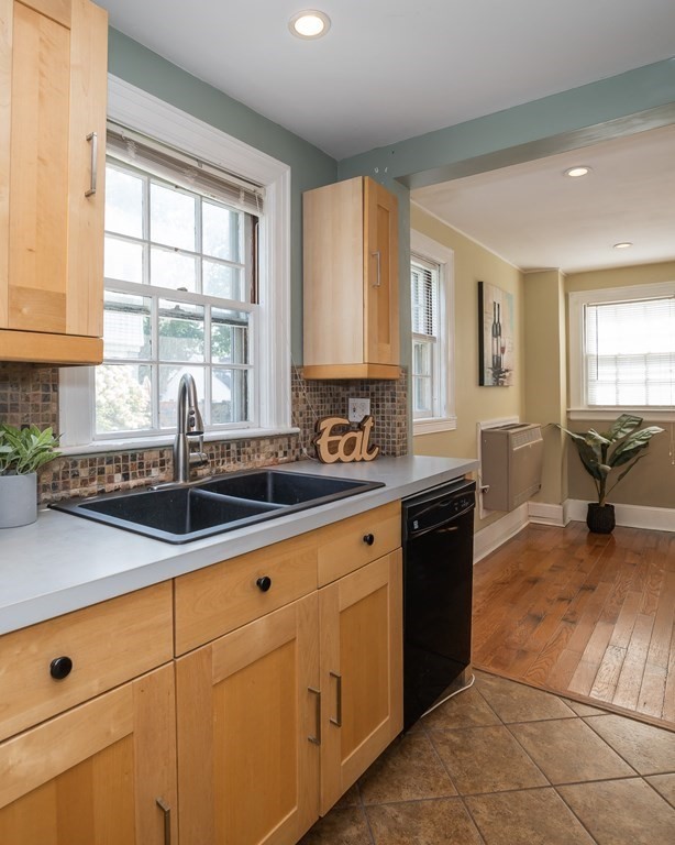 35 Bronson Terrace Springfield, MA 01108 - Photo 4 of 39 a kitchen with sink cabinets and window