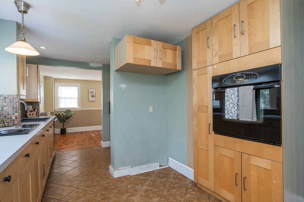 35 Bronson Terrace Springfield, MA 01108 - Photo 7 of 39 a view of a kitchen cabinets and a wooden floor