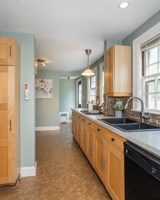 35 Bronson Terrace Springfield, MA 01108 - Photo 9 of 39 a large bathroom with a double vanity sink a mirror and a bathtub
