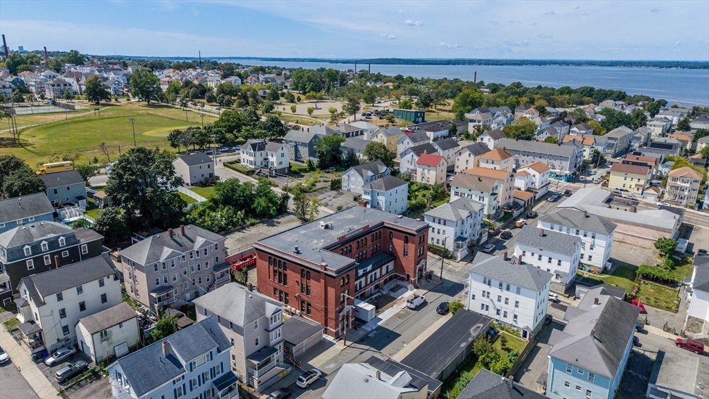 403 Division Street, Unit 17 Fall River, MA 02721 - Photo 25 of 29 an aerial view of residential houses with outdoor space and swimming pool