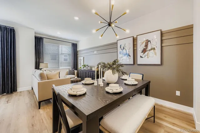 a view of a dining room with furniture window and wooden floor