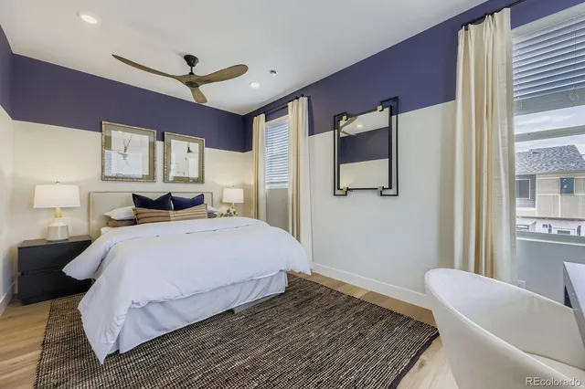 a bedroom with a large bed and a couch