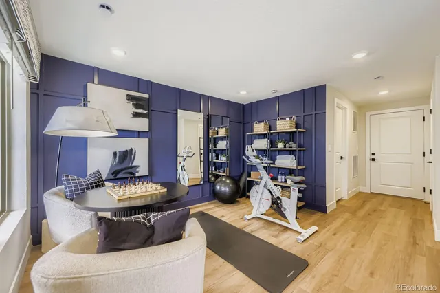 a living room with furniture a table and a fireplace