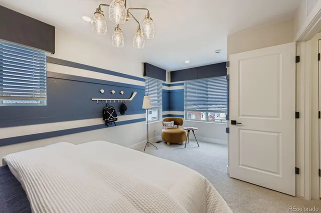 a bedroom with bed and window