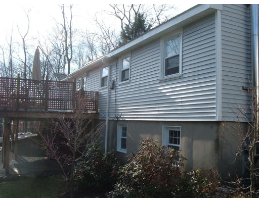 44 Great Road Maynard, MA 01754 - Photo 11 of 19 a front view of a house with a garden