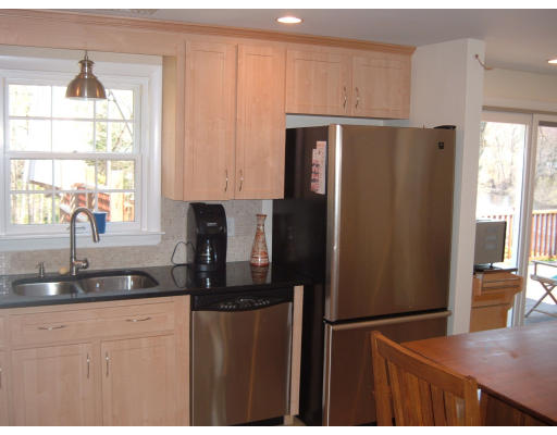 44 Great Road Maynard, MA 01754 - Photo 5 of 19 a kitchen with stainless steel appliances granite countertop a refrigerator and a sink