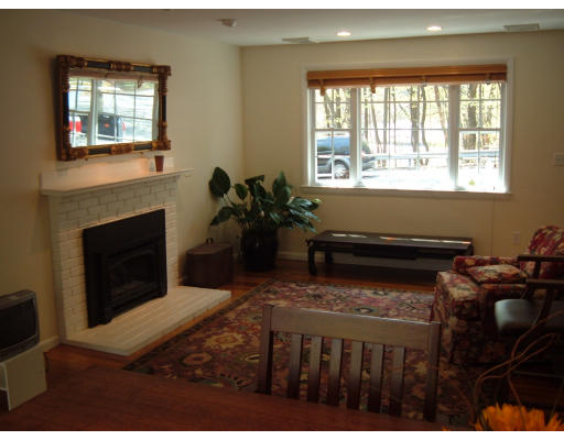 44 Great Road Maynard, MA 01754 - Photo 8 of 19 a living room with furniture a window and a fireplace