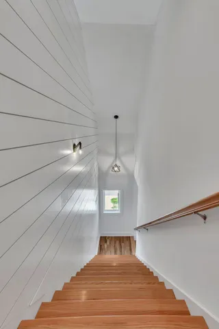 a bedroom with a bed and a ceiling fan