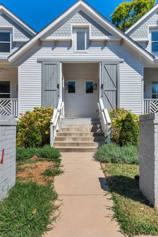a front view of a house with garden