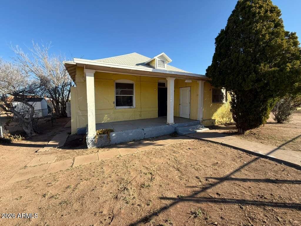 1014 East 14th Street Douglas, AZ 85607 - Photo 1 of 38 a view of a house with snow on the side of the road